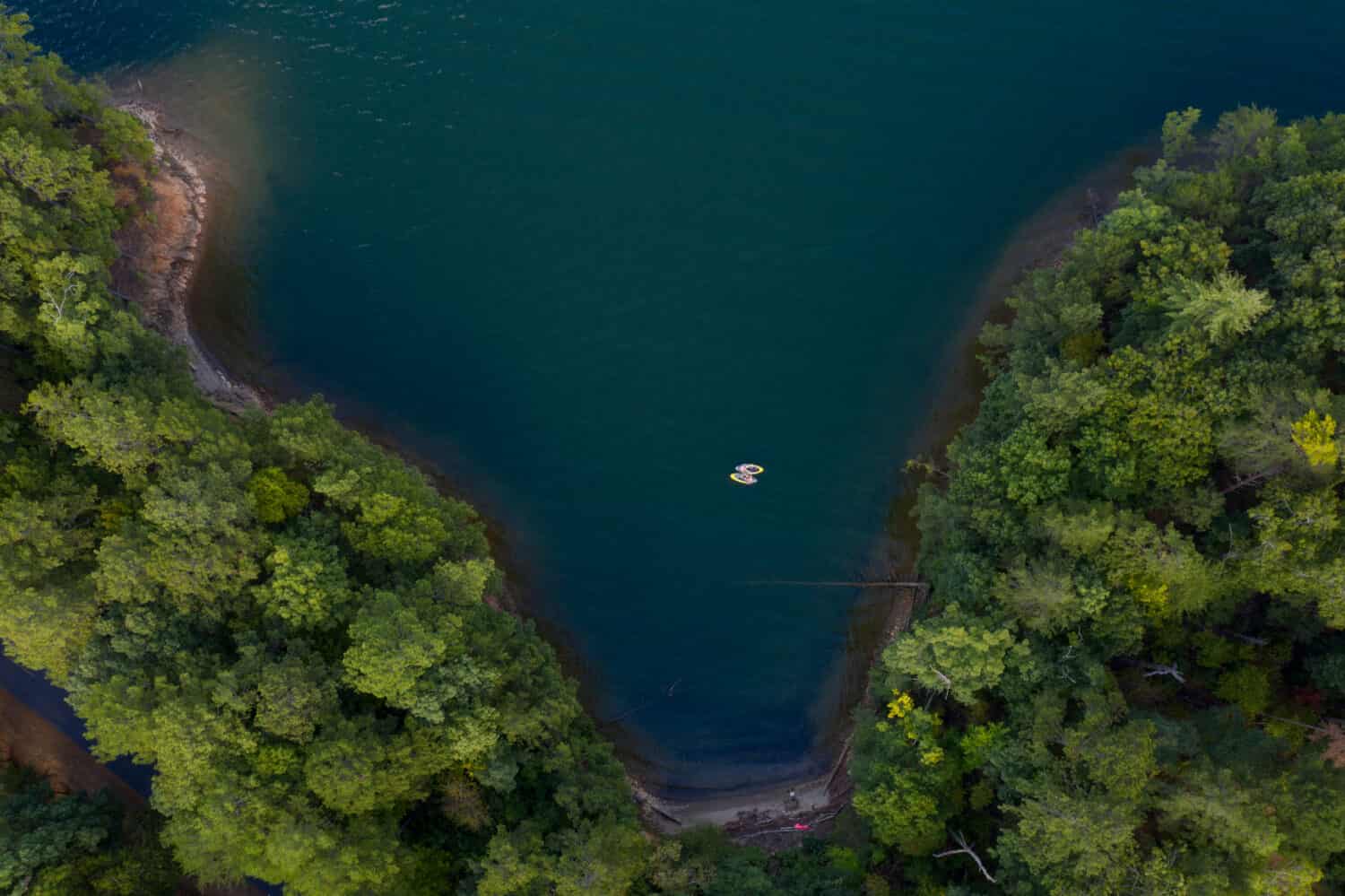 Two Kayakers hanging out in a cove in Carter Lake, Elijay, Georgia.  September 20, 2019.  Picture taken with a drone 