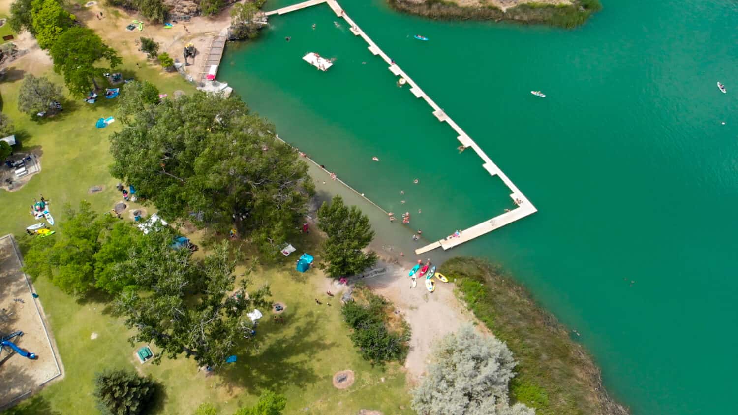 Aerial view of Dierkes Park Lake with tourists in summer on a beautiful sunny day, Twin Falls, Idaho.