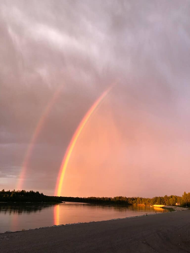 A double rainbow is caused by an initial light refraction and then a reflection of that light.