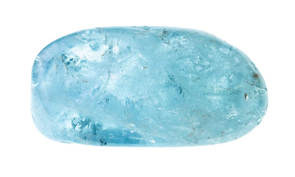 polished aquamarine (blue beryl) gemstone cutout on white background