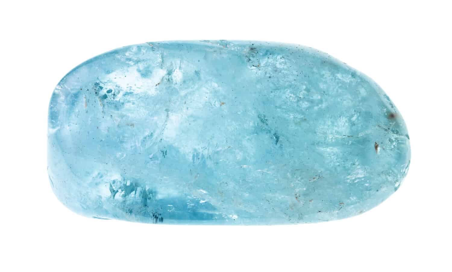 polished aquamarine (blue beryl) gemstone cutout on white background