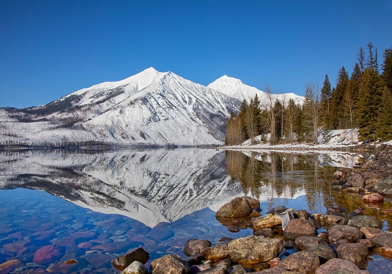 Stanton mountain on Lake McDonald reflection, winter in Glacier National Park, Montana, USA