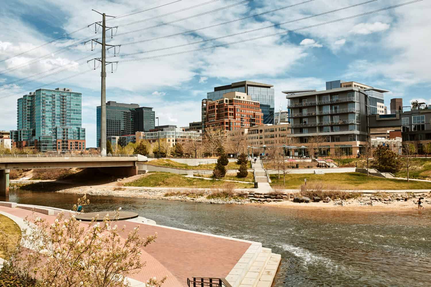 South Platte River surrounded by apartments and office buildings at Shoemaker Plaza in Confluence Park. Denver, Colorado