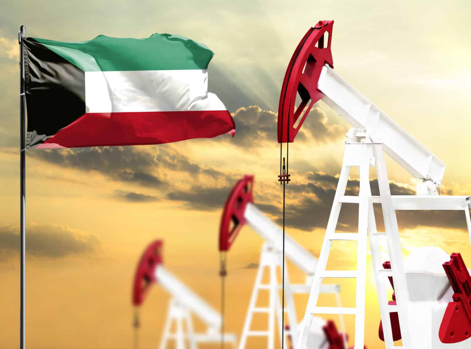 Oil rigs against the backdrop of the colorful sky and a flagpole with the flag of Kuwait. The concept of oil production, minerals, development of new deposits.