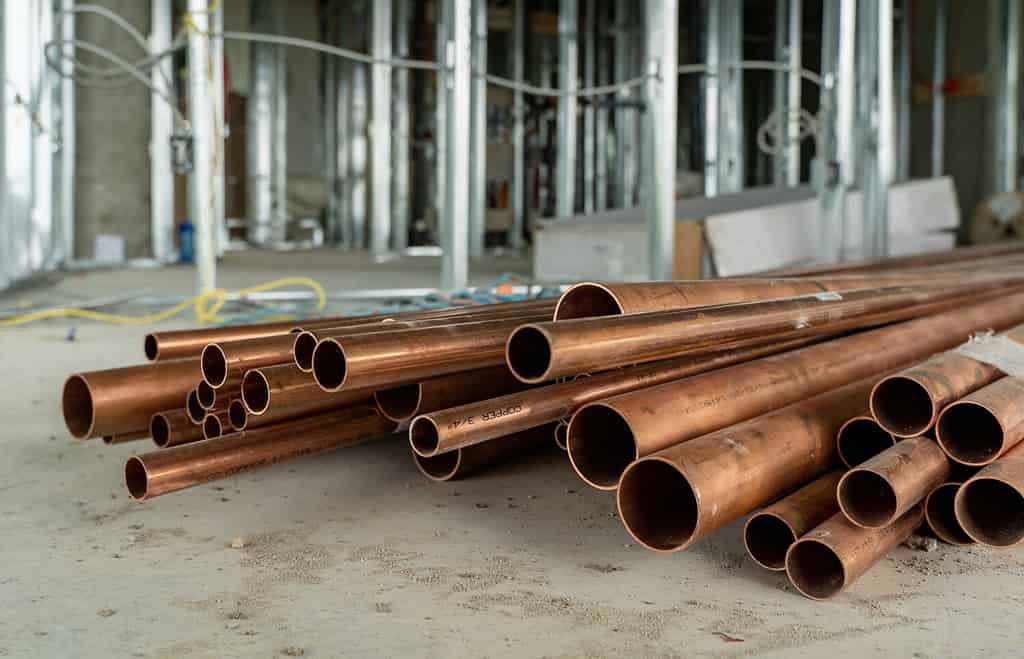 A pile of copper pipe at a condominium construction site in Canada
