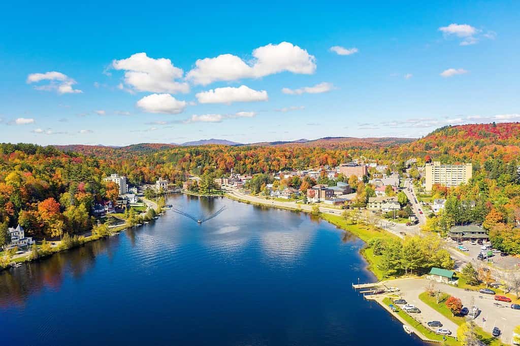 Colorful aerial view of Saranac Lake New York in the Adirondack Mountains during the fall.