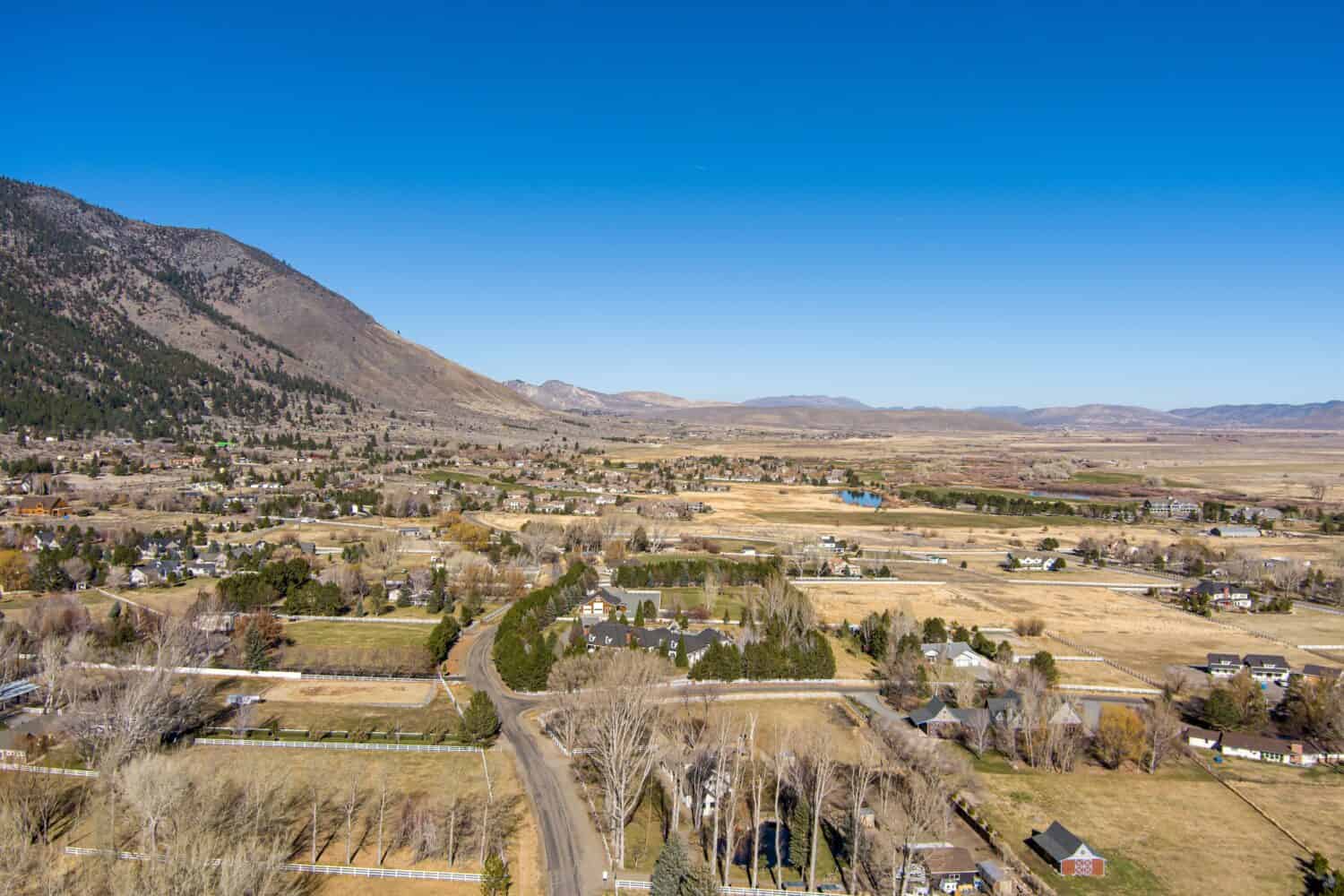 Aerial View of the Genoa Nevada area in Carson Valley with barren trees, farmland and ranches.