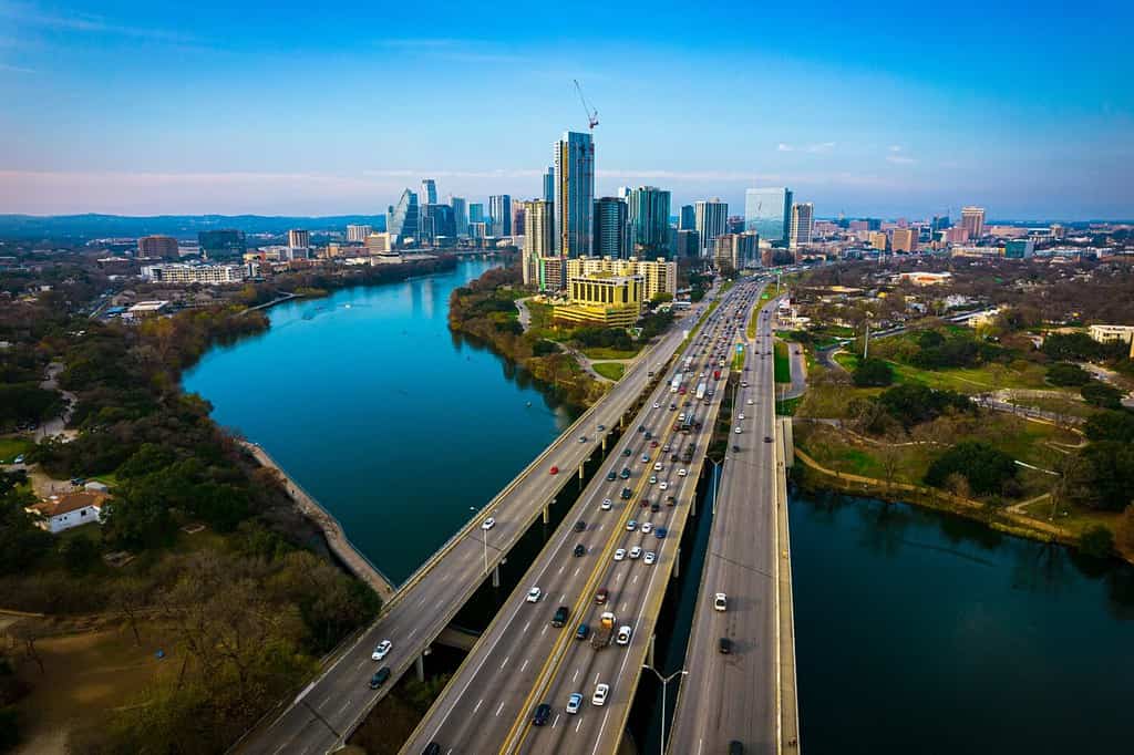 Austin Texas USA a gorgeous capital City of Texas aerial drone views above Coloradp River and Interstate 35 and tall skyscrapers growing Cityscape