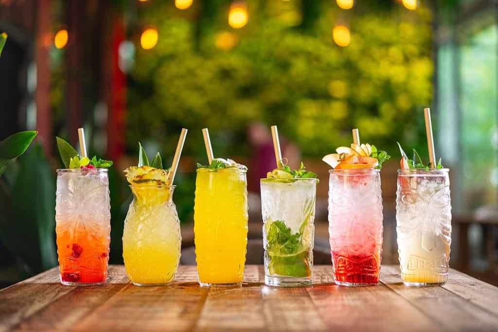 different types of tropical cocktails, summer style tiki bar drinks