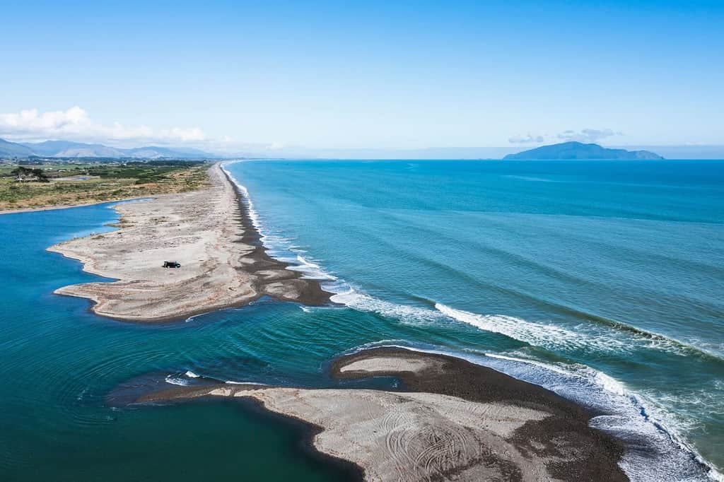Aerial shot at the otaki river mouth on the Kapiti coast on a fine autumn day The Tasman Sea is calm with a light surf Looking south
