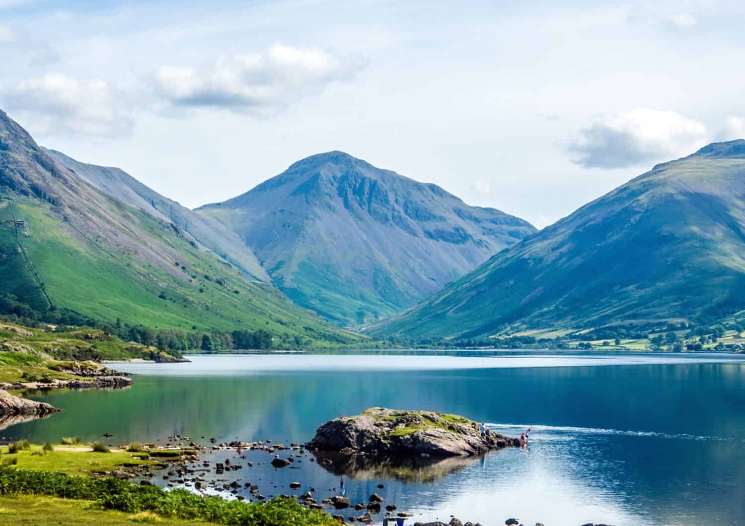 Wastwater is the deepest lake in England. Scafell Pike, the tallest mountain, can be seen in the distance.