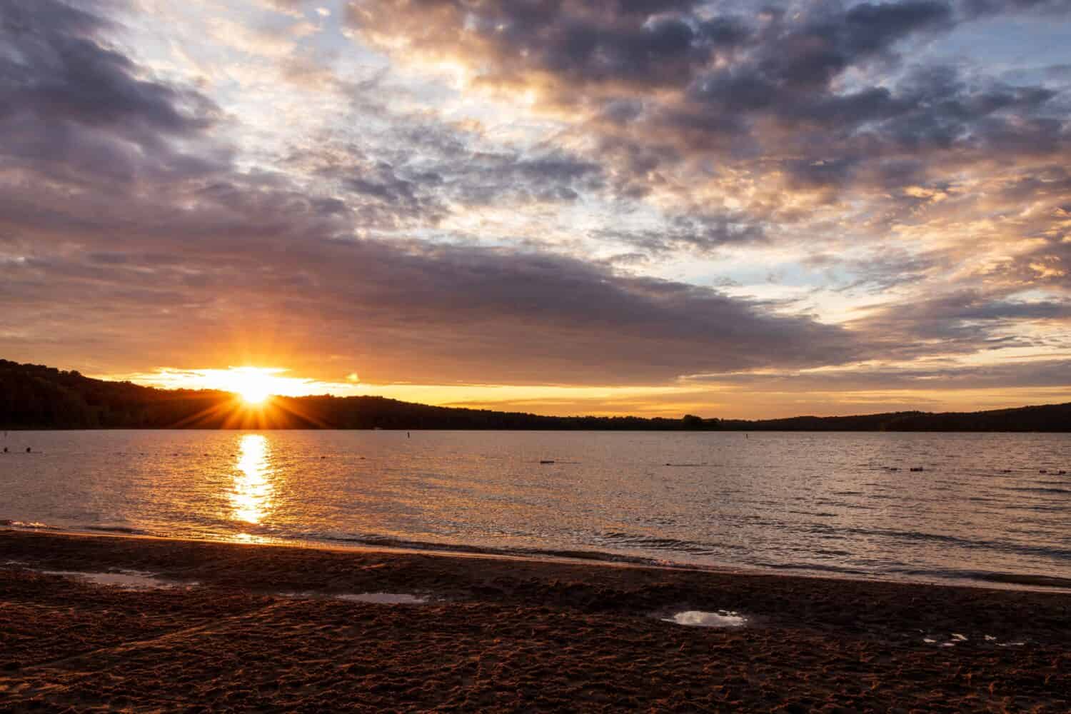 Sunset with cloudy sky viewed from the shore of Patoka Lake 