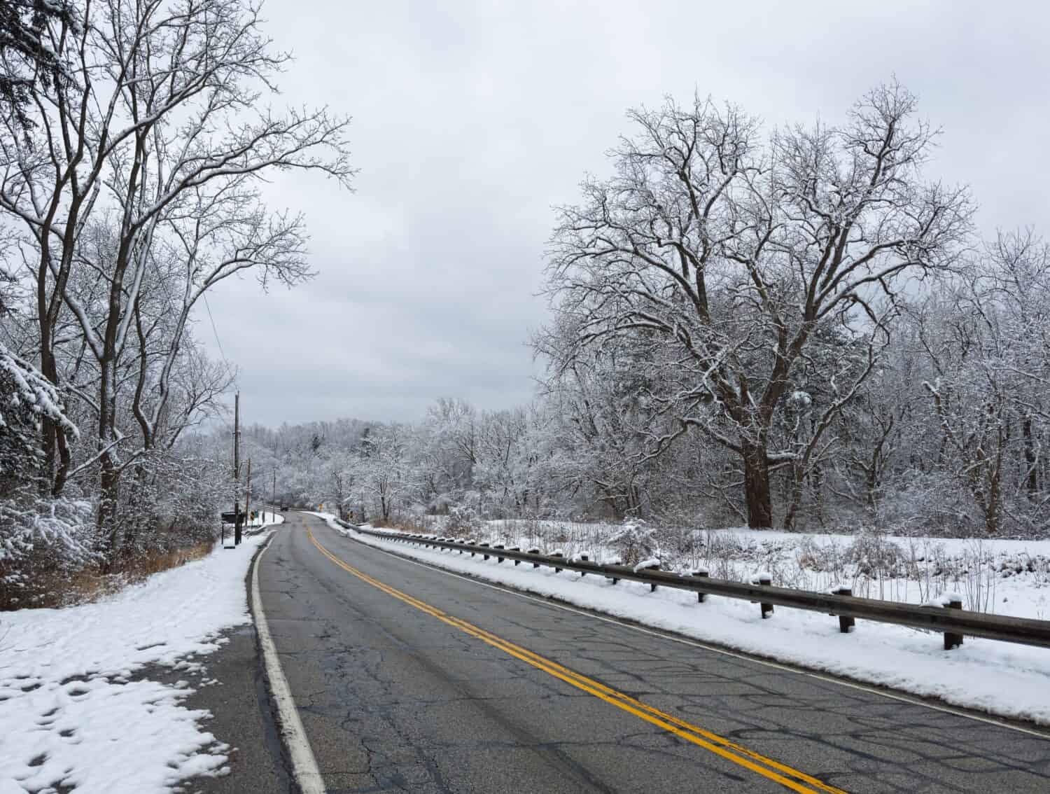 A road in Ohio's Cuyahoga Valley near Cleveland runs through a wintry landscape after freshly fallen snow