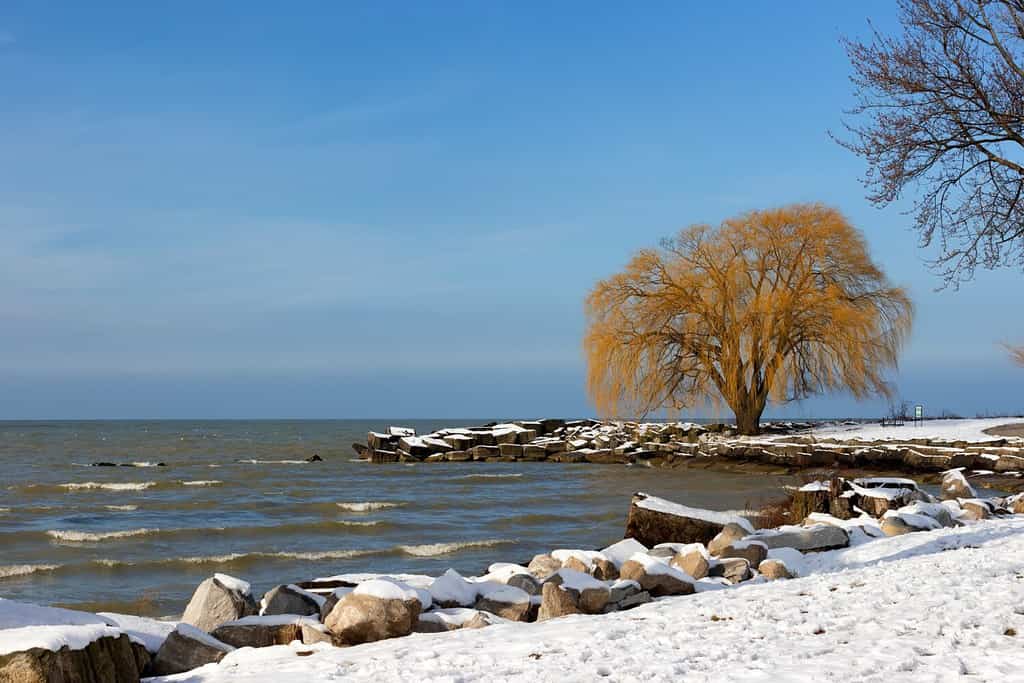 Sunlight emerges after a wintery storm dumps snow along the shores of Lake Erie at Edgewater Park in Cleveland, Ohio.