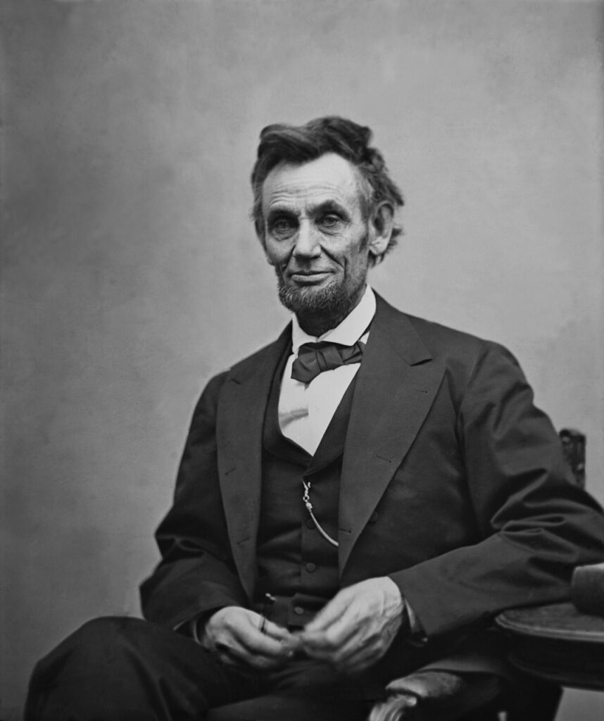 Abraham Lincoln (1809-1865) seated and holding his spectacles and a pencil on Feb. 5, 1865 in portrait by Alexander Gardner.