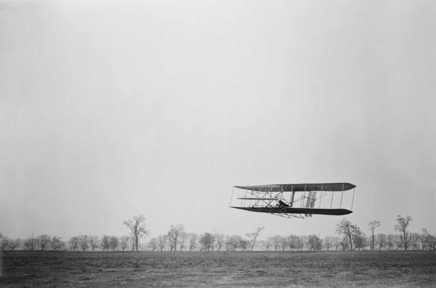 Orville Wright 1871-1948 in flight over treetops covering a distance of approximately 1 760 feet in 40 1/5 seconds at Huffman Prairie Dayton Ohio. November 16 1904.