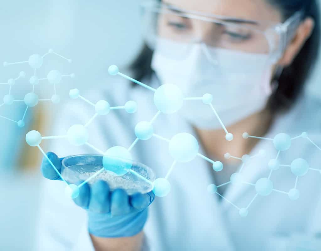 science, chemistry, biology, medicine and people concept - close up of young female scientist holding petri dish with powder in clinical laboratory