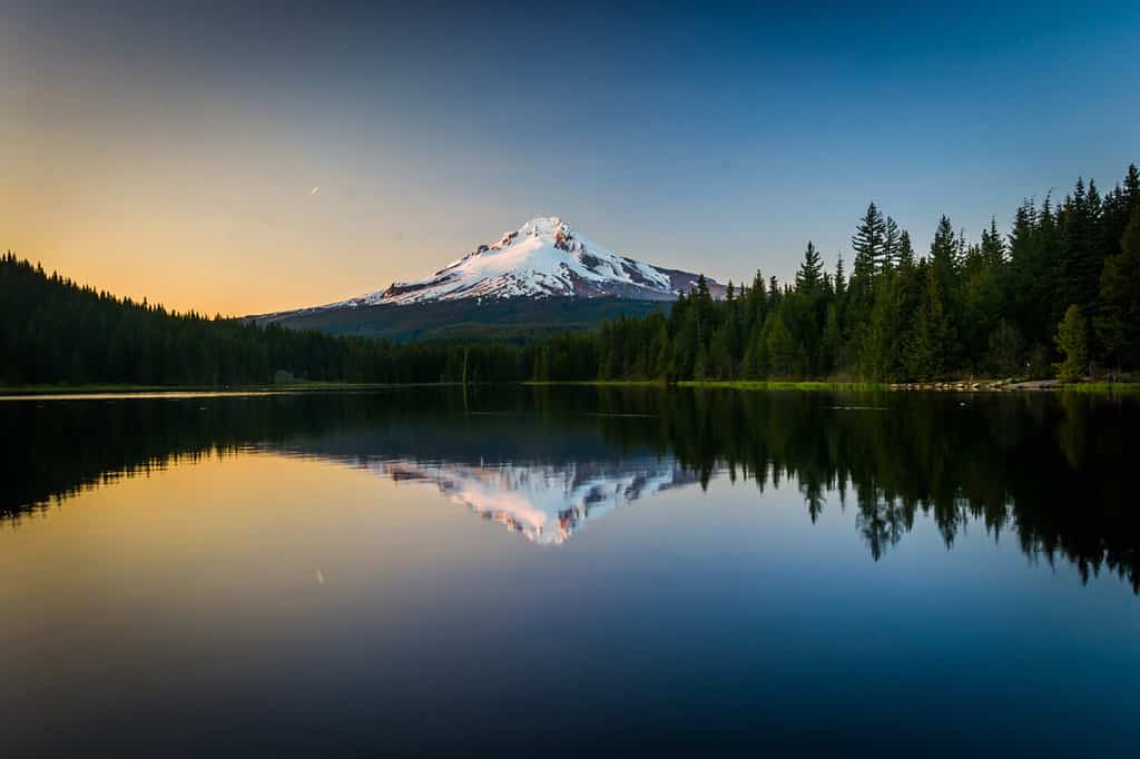 Mount Hood reflecting in Trillium Lake at sunset, in Mount Hood National Forest, Oregon.