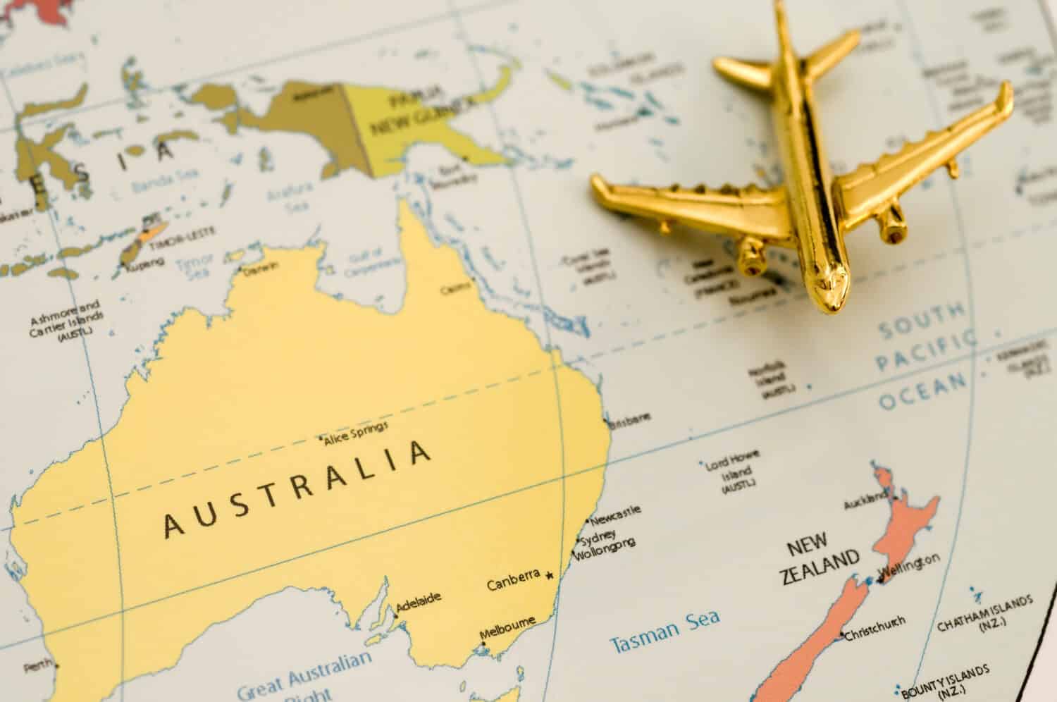 Plane Heading to New Zealand. Map is Royalty Free Off a Government Website.