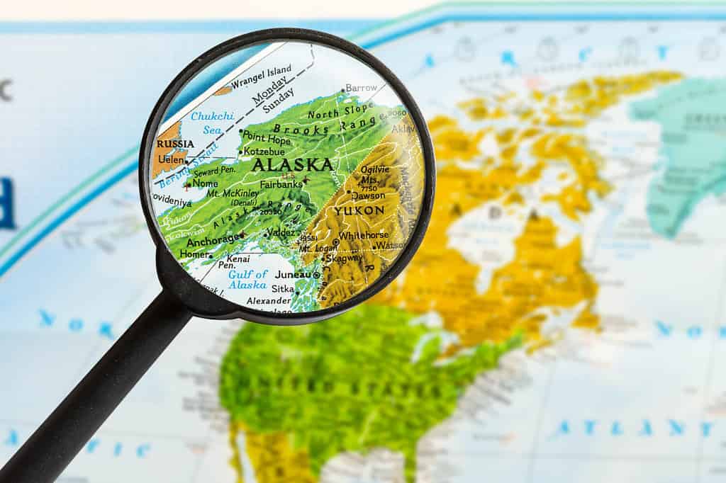 map of State of Alaska through magnifying glass