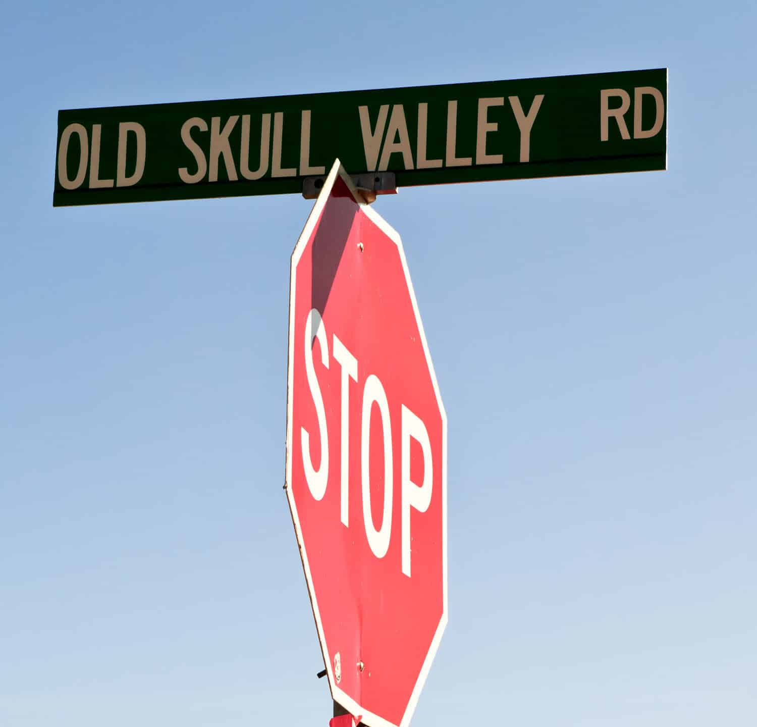 An old road sign in the town of Skull Valley Arizona indicating where old bones dwell.