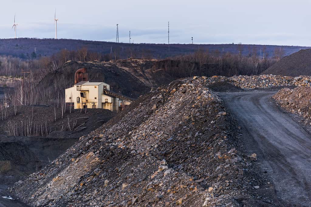 Atop a coal waste pile at an abandoned anthracite coal mine in Pennsylvania. A wind farm is in the background.