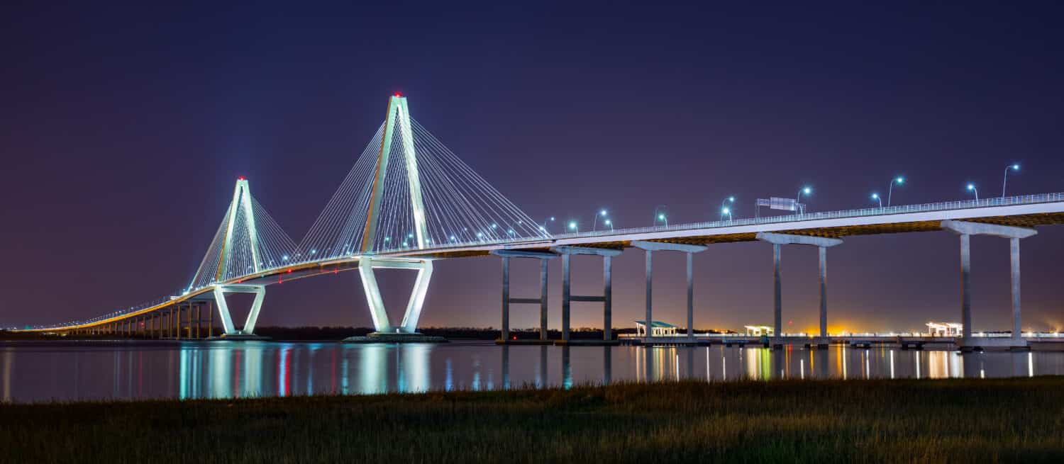 The Arthur Ravenel Jr. Bridge lit up at night in Charleston South Carolina.