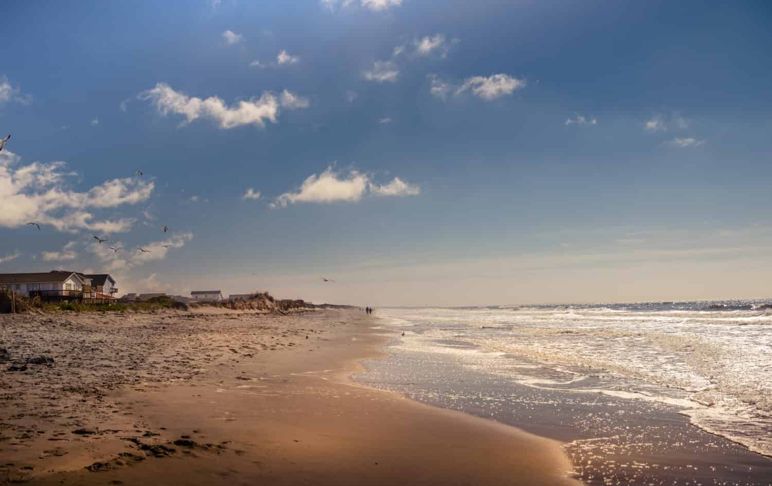 Oak Island Beach in Brunswick County, North Carolina, taken early morning during fall season. A  beautiful resort in the east part of the state, few miles from Wilmington, home of Michael Jordan.