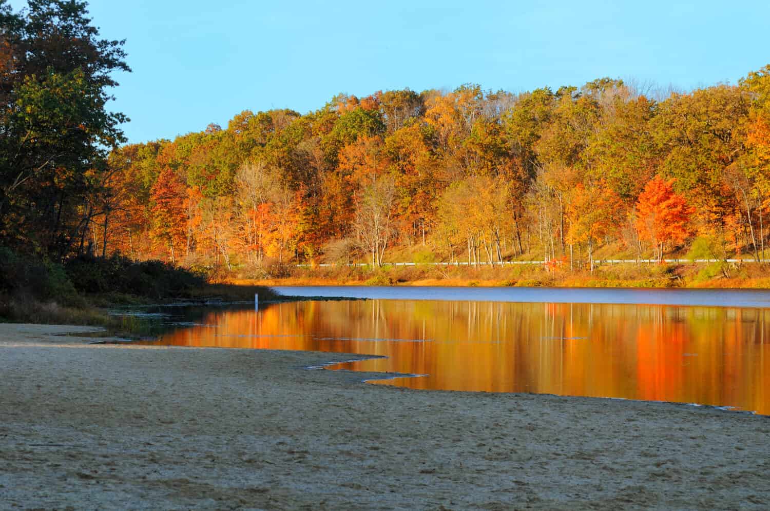 Brilliant autumn colors reflected in a serene lake (Punderson Lake in northeast Ohio)