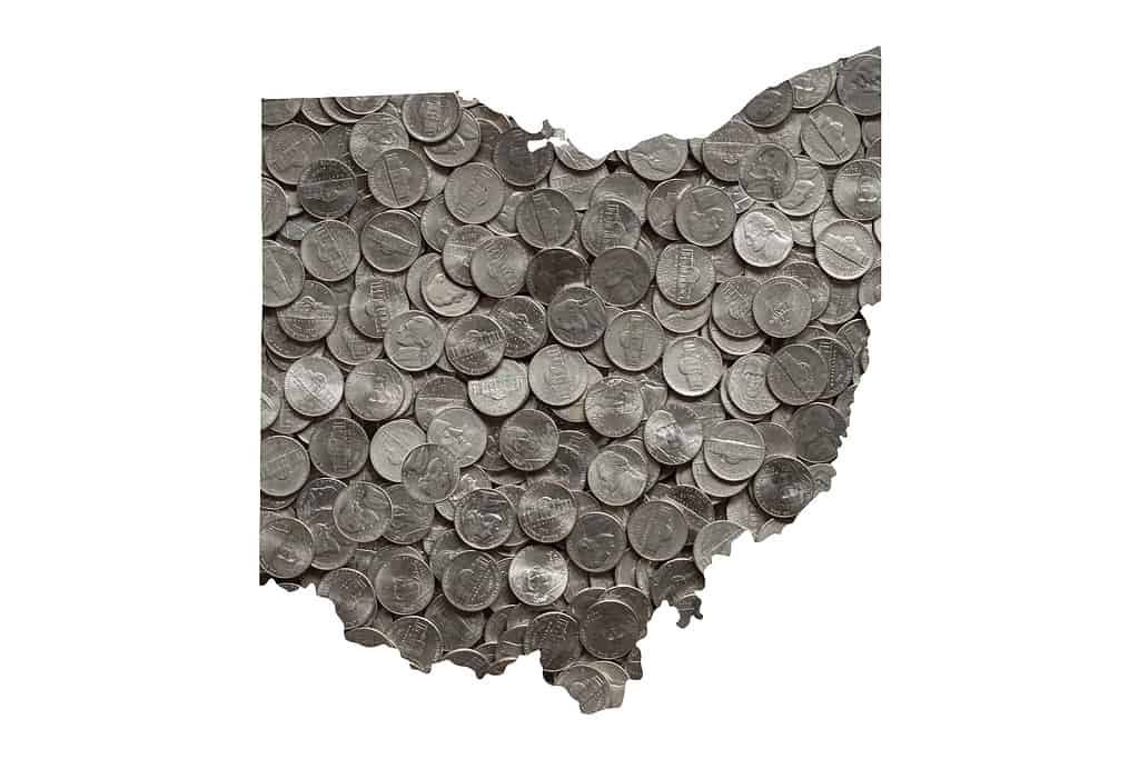 Ohio State Map Outline and Piles of Silver Shiny United States Five Cent Nickels