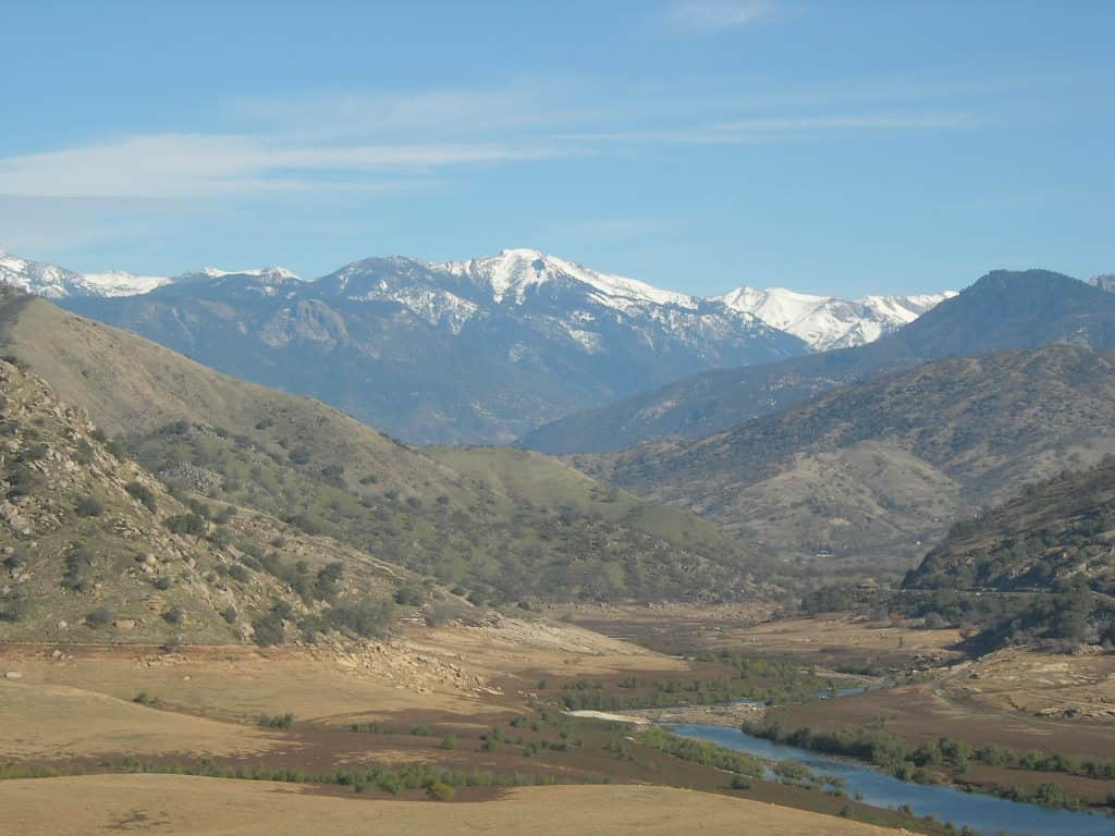 The lower Kaweah River at Terminus Dam, Tulare County, California; Looking towards Three Rivers and Sequoia National Park in the Sierra Nevada.