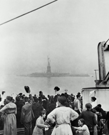ELLIS ISLAND VIEW, DECK OF SHIP PULLING INTO NEW YORK HARBOR, C. 1900
