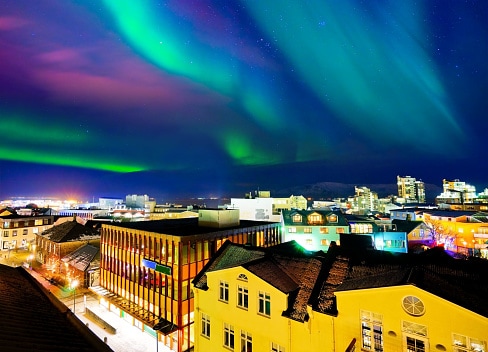 Northern light from the city center in Reykjavik, Iceland.