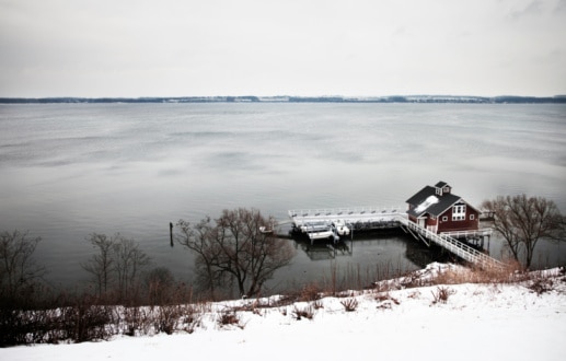 Winter landscape of Seneca lake with boathouse