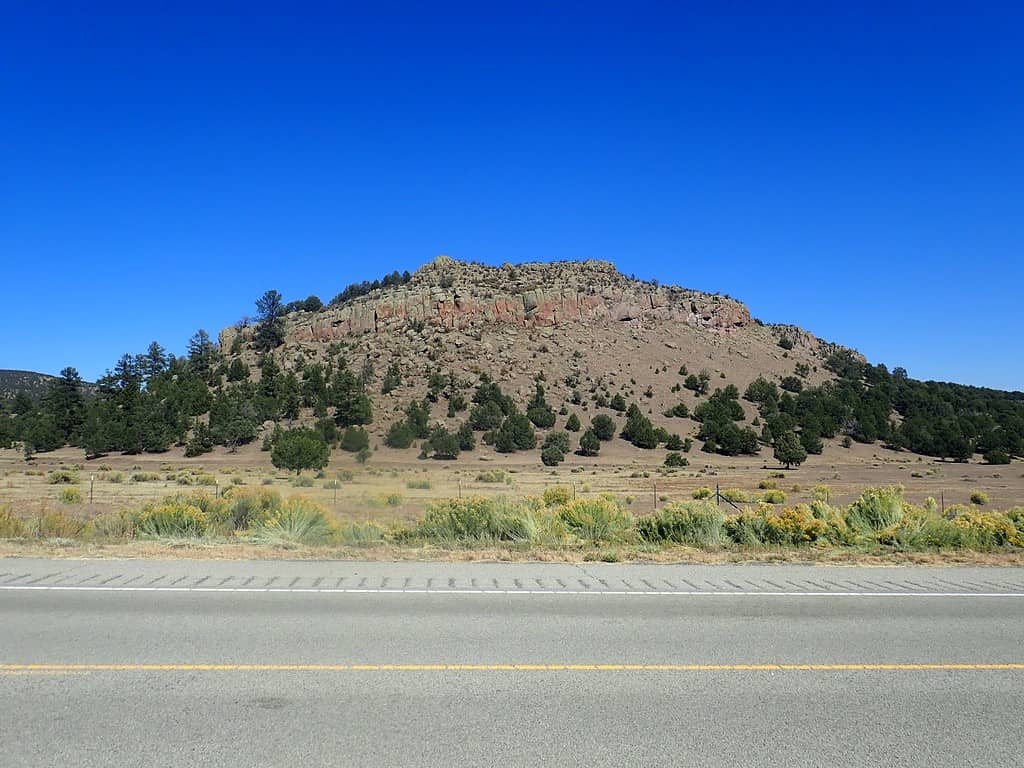 This image shows a small mesa in White House Canyon, New Mexico, US, that is capped with andesite of the Mogollon-Datil volcanic field.