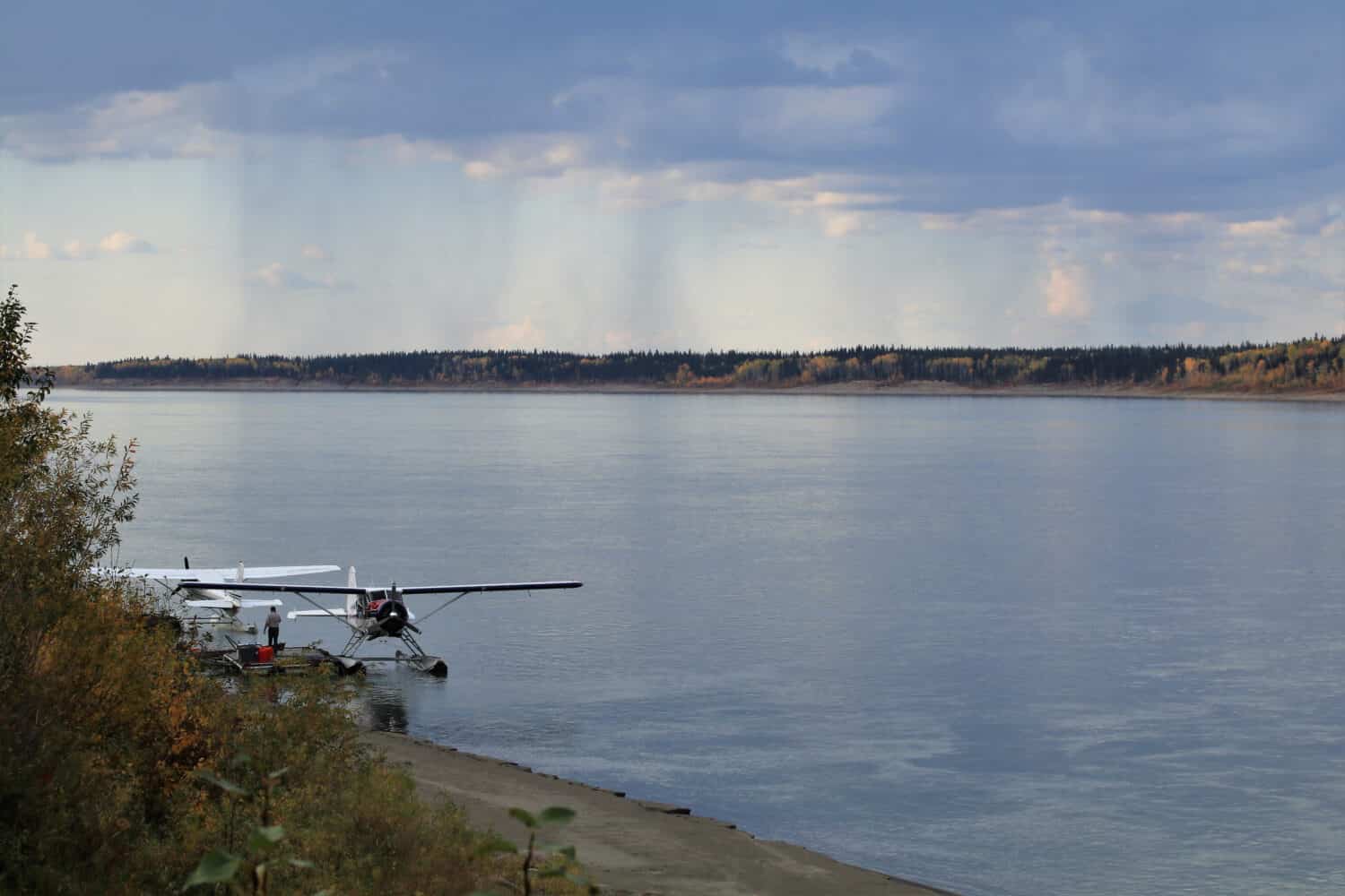 View over the Mackenzie River in Fort Simpson where the water plane piers of the local air companies are located.