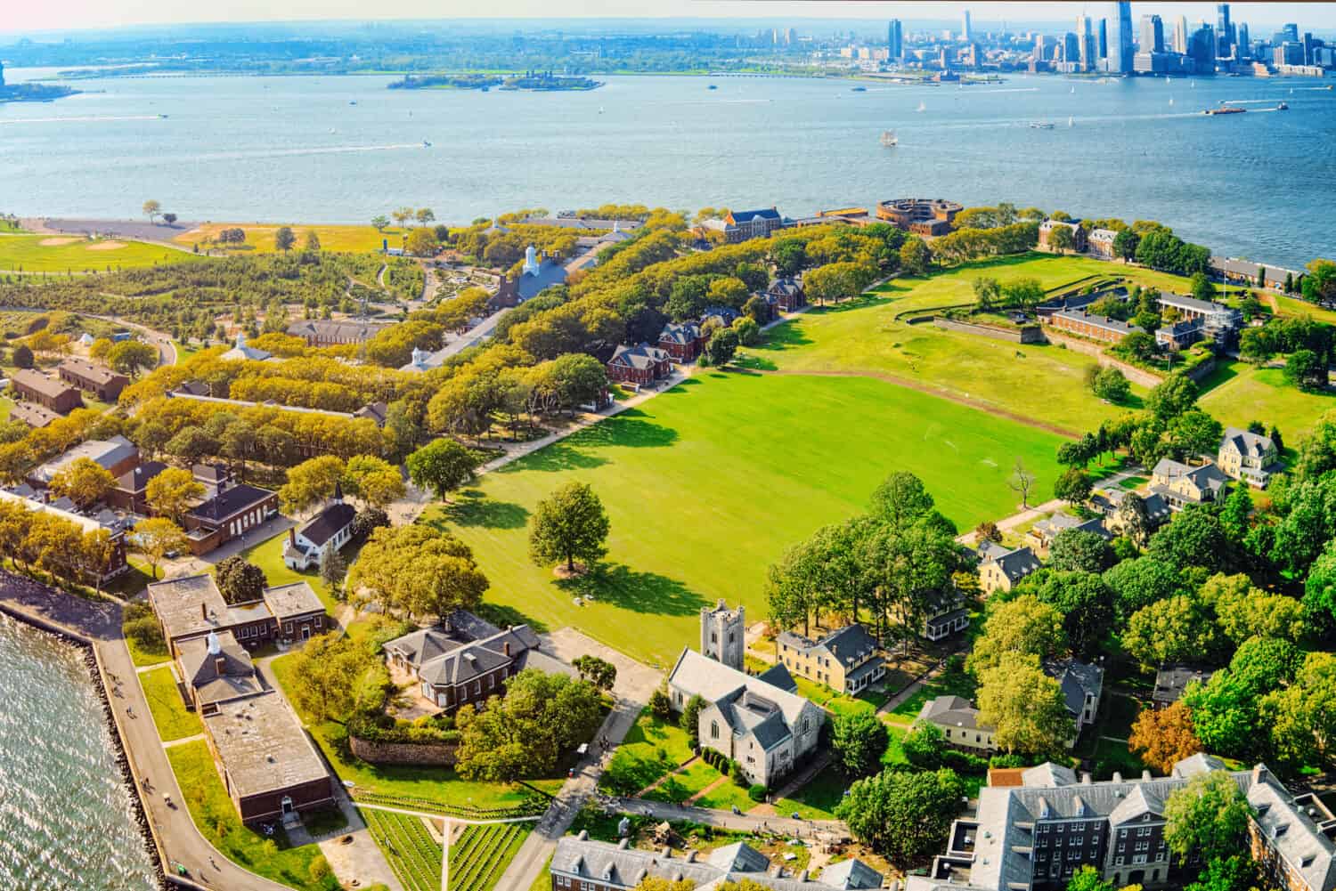 Fly over, view Governors Island National Monument near New York and Manhattan from a bird's eye view.