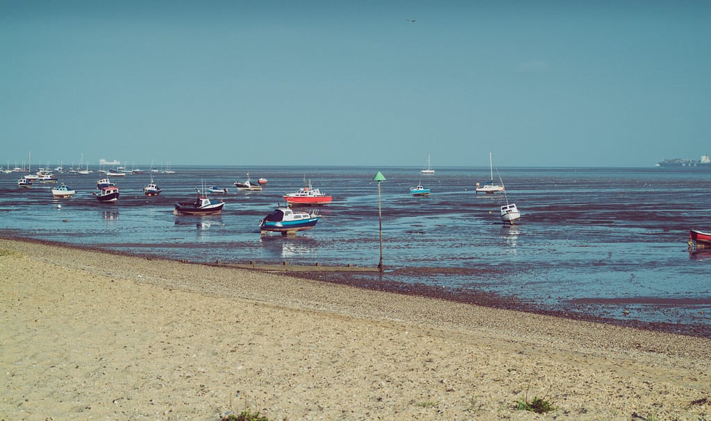 small boats photographed during low tide in Shoeburyness, Essex, UK