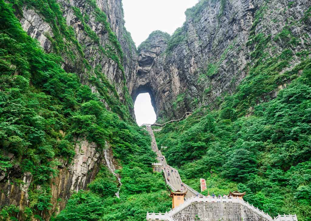 The Tianmen Mountain with a view of the cave Known as The Heaven's Gate and the steep 999 stairs at Zhangjiagie, Hunan Province, China, Asia