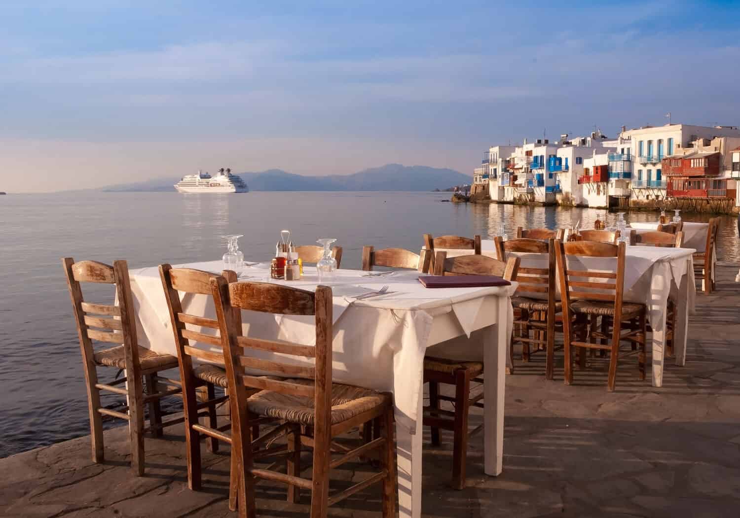 Restaurant near the sea at Little Venice on the island of Mykonos in Greece at sunset - very well-known