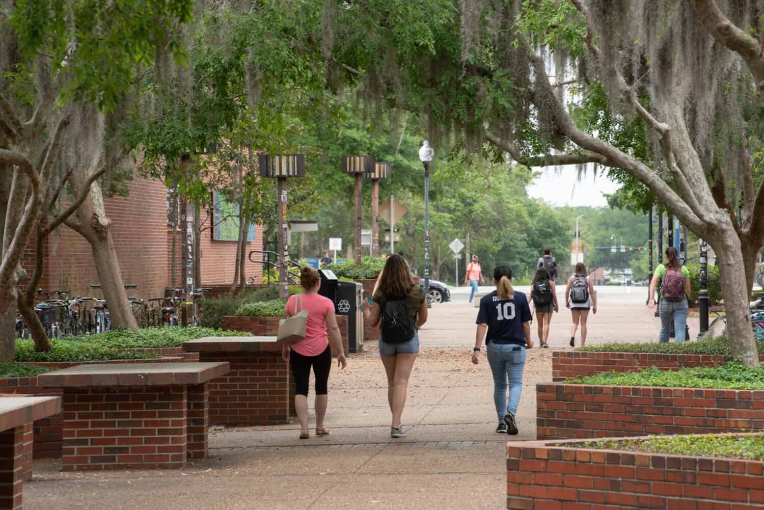 College students walk across campus between classes