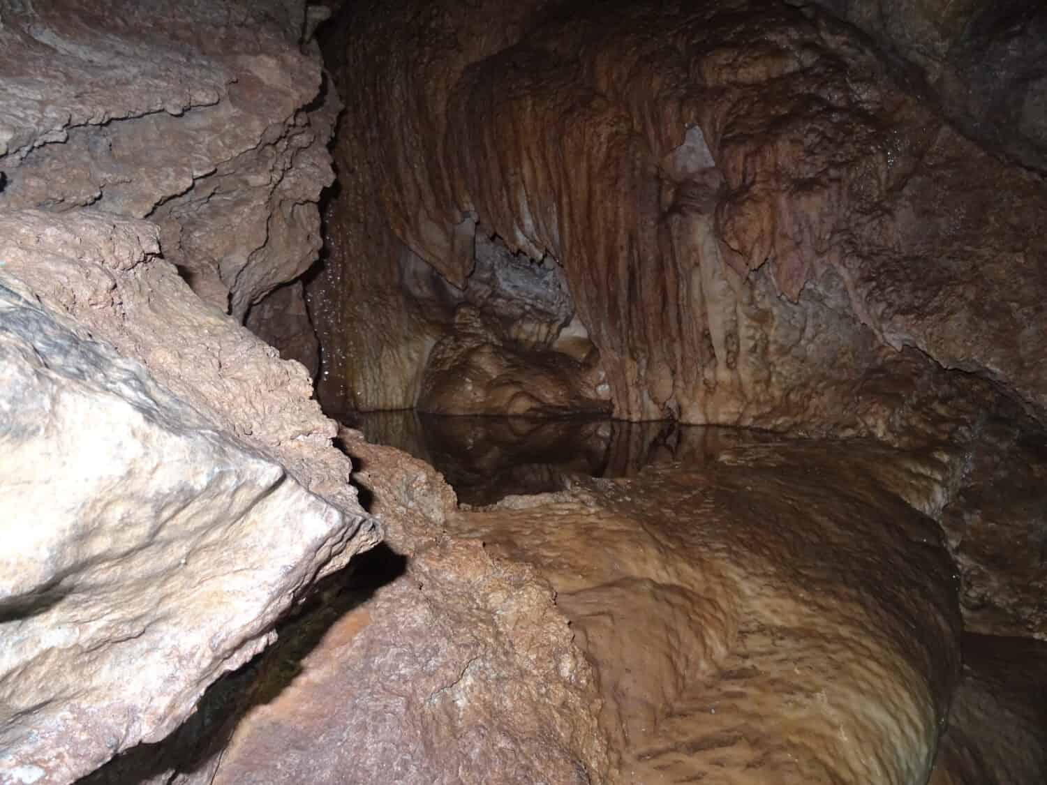 Cave Pool Surrounded by Stalactites