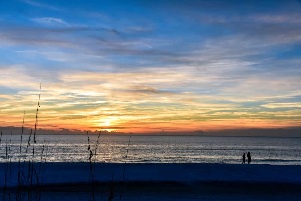 Tourists enjoy a beautiful sunset at TH Stone Memorial St. Joseph Peninsula State Park on the Florida Panhandle, which is still recovering after 2018's Hurricane Michael.