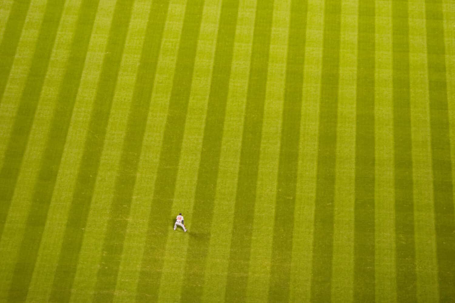 Baseball player on a large baseball field