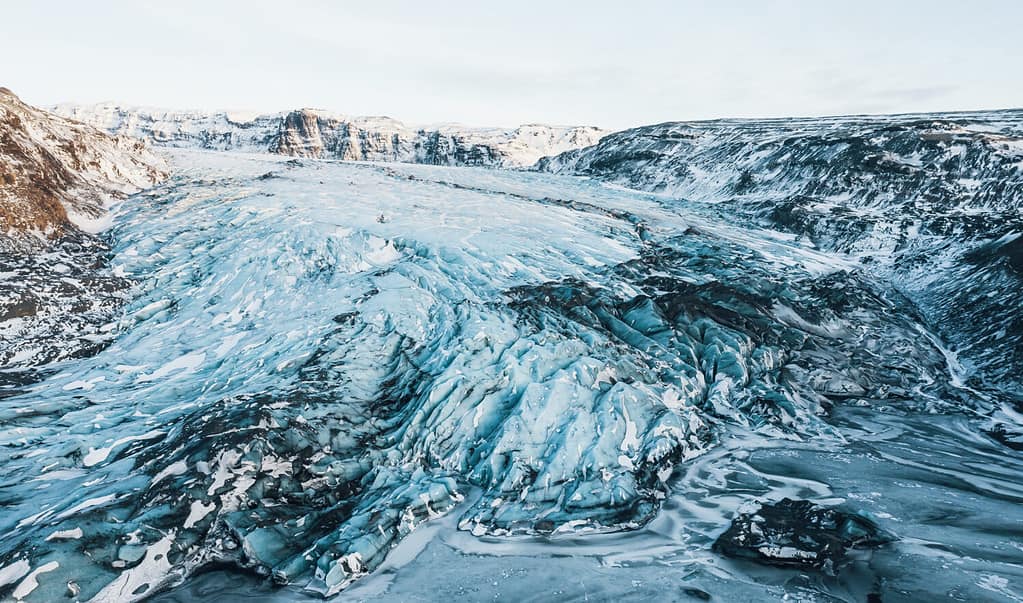 Aerial drone top view glacier iceland Sólheimajökull, Melting Ice, Climate Change and Global Warming Concept