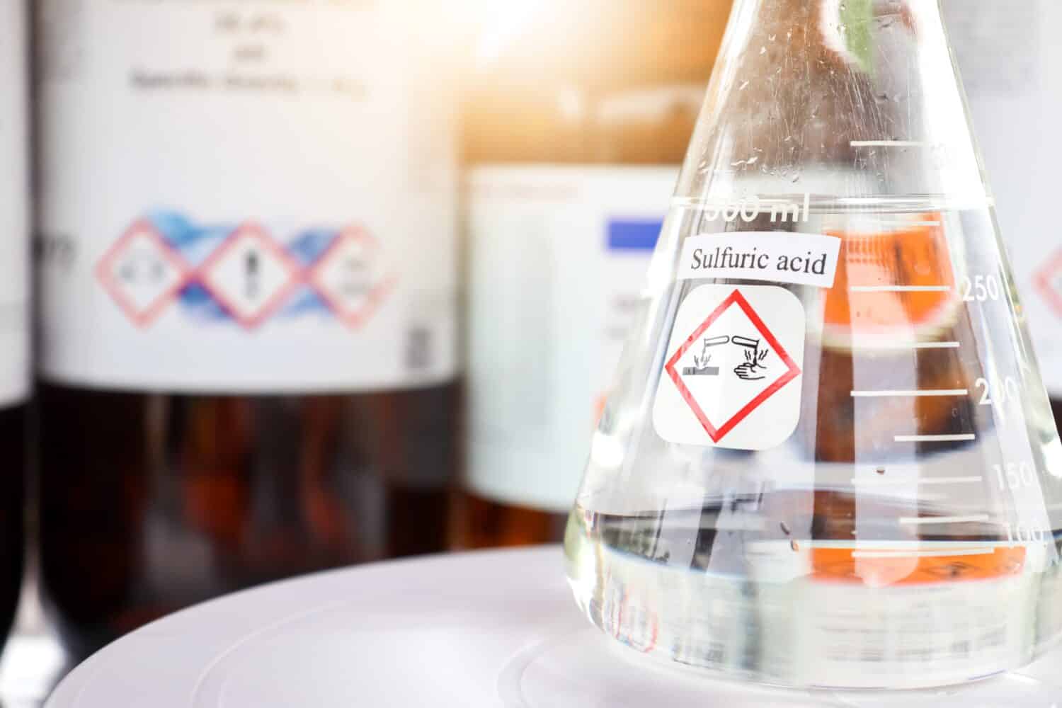 sulfuric acid in glass, chemical in the laboratory and industry