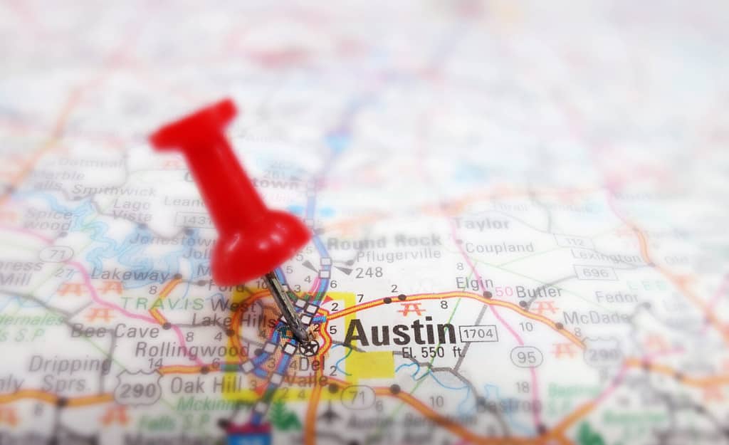 Closeup of a map of Austin Texas with red tack