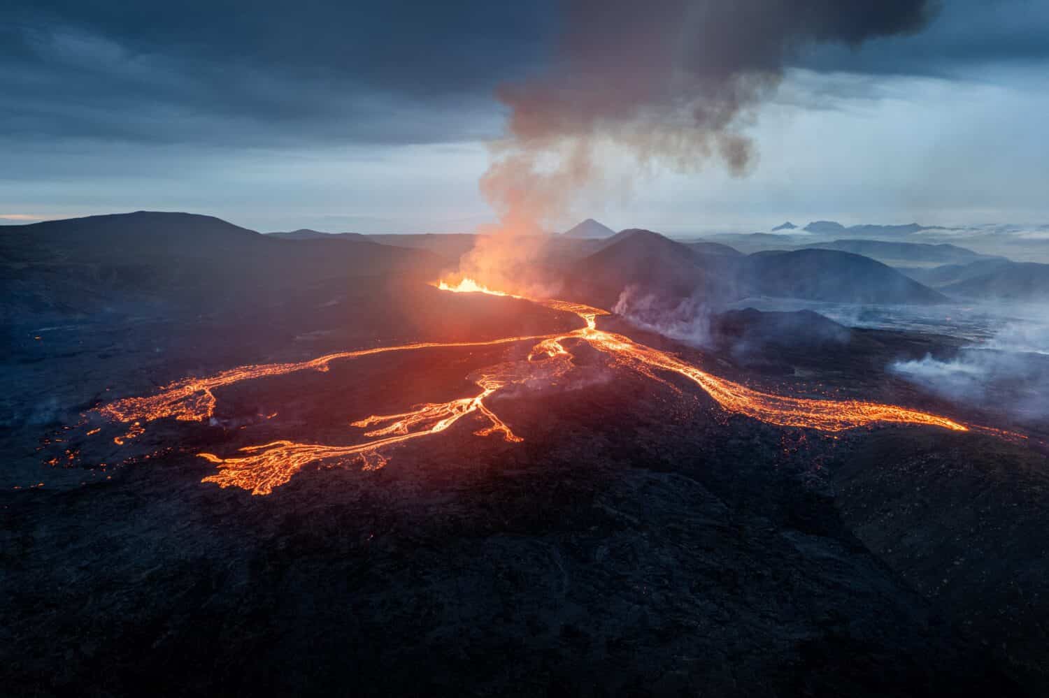 A scenic view of lava in the Fagradalsfjall volcano in Iceland on cloudy sky background