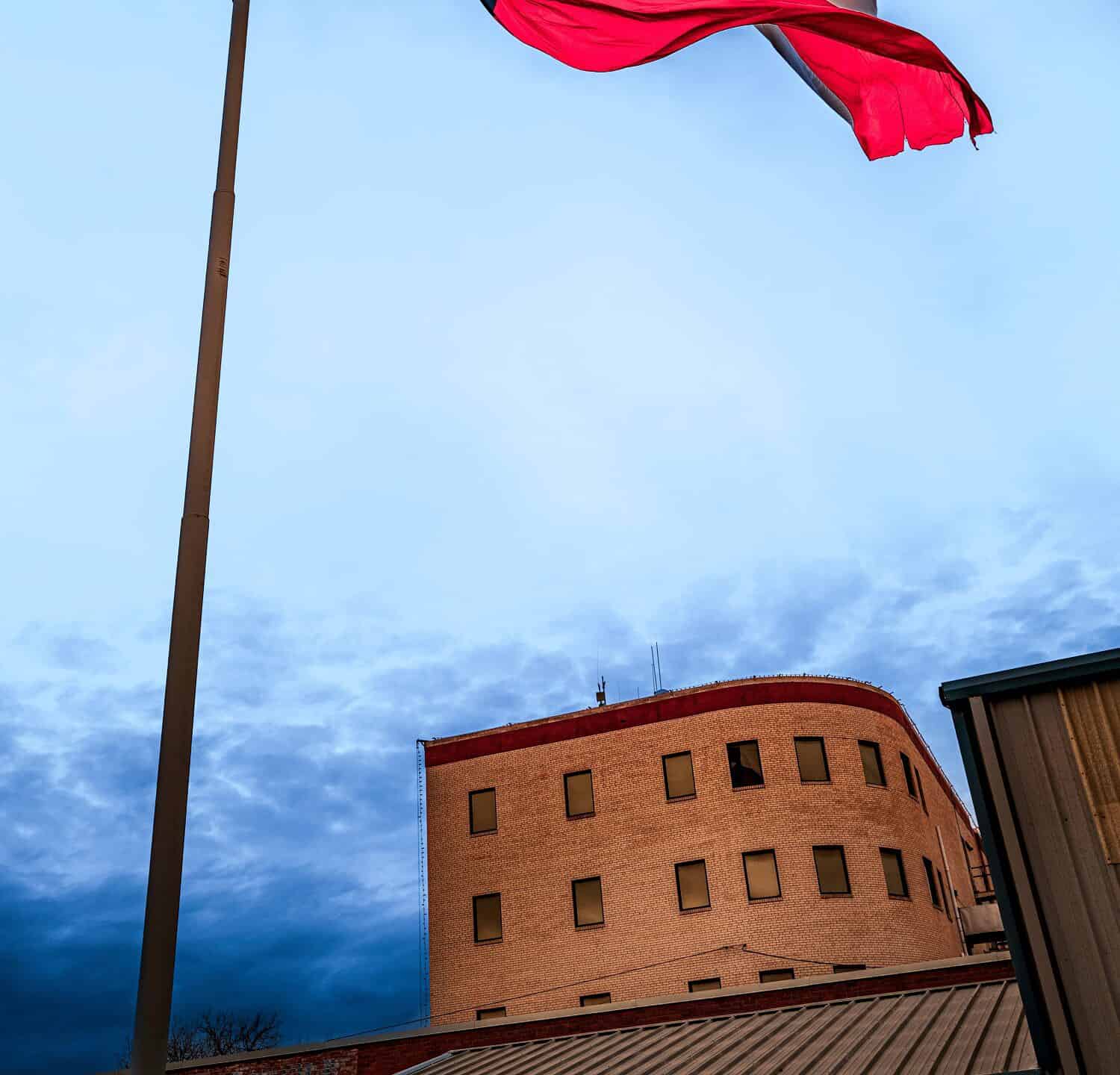 Lone Star Texas State Flag waving in the wind over Odessa in Texas, USA, dramatic cloudscape