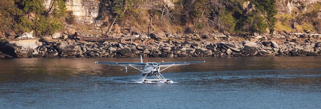 Seaplane in Water ready for Take off with Rocky Shore in Background. Nanaimo, Vancouver Island, British Columbia, Canada.